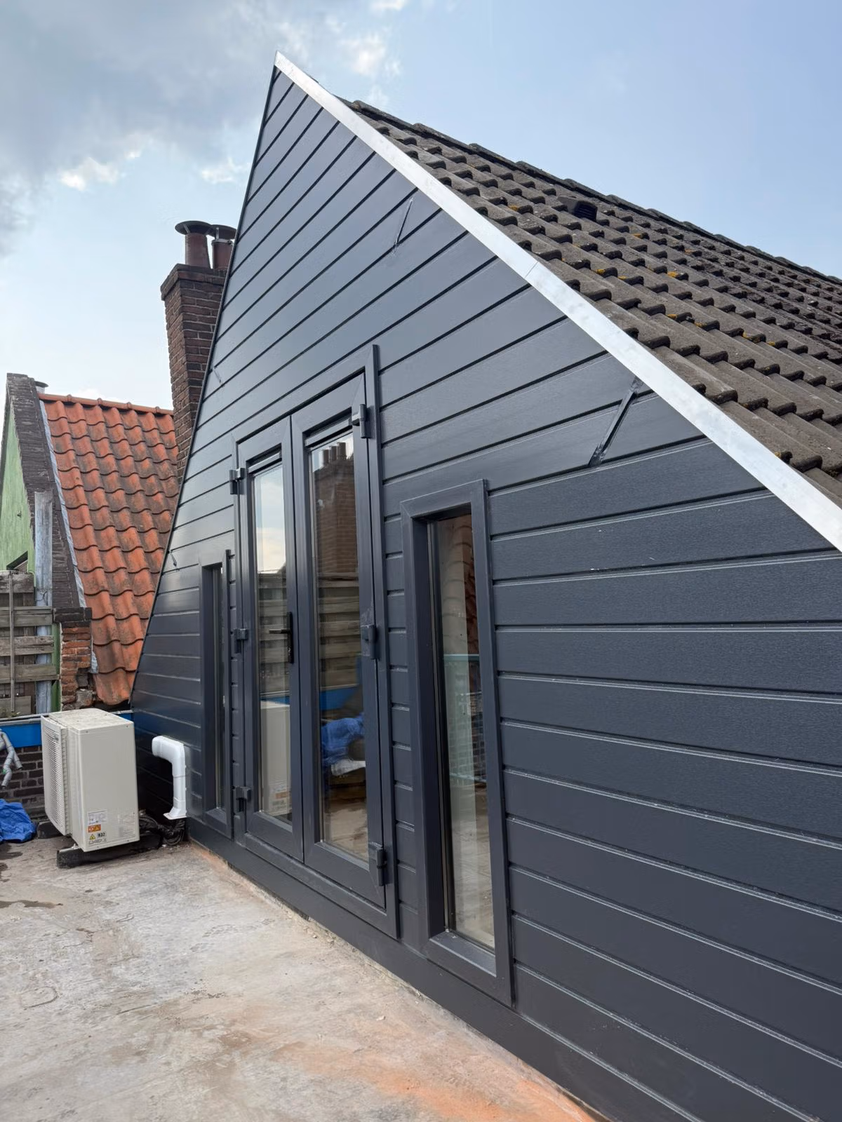 Gevelbekleding op een huis als bescherming tegen het milieu